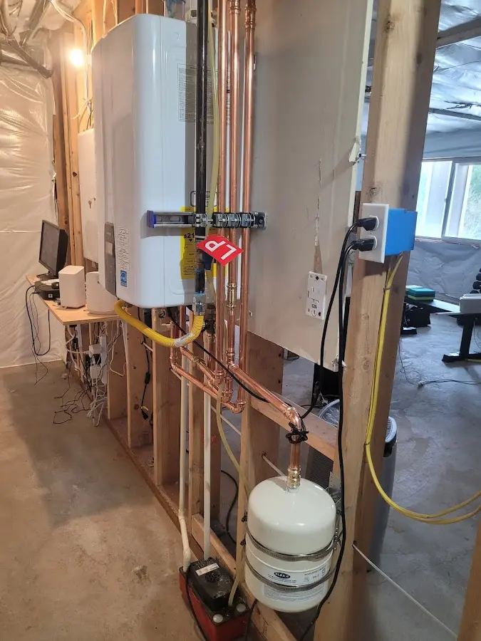 Licensed plumber repairing a kitchen sink in Ellisburg