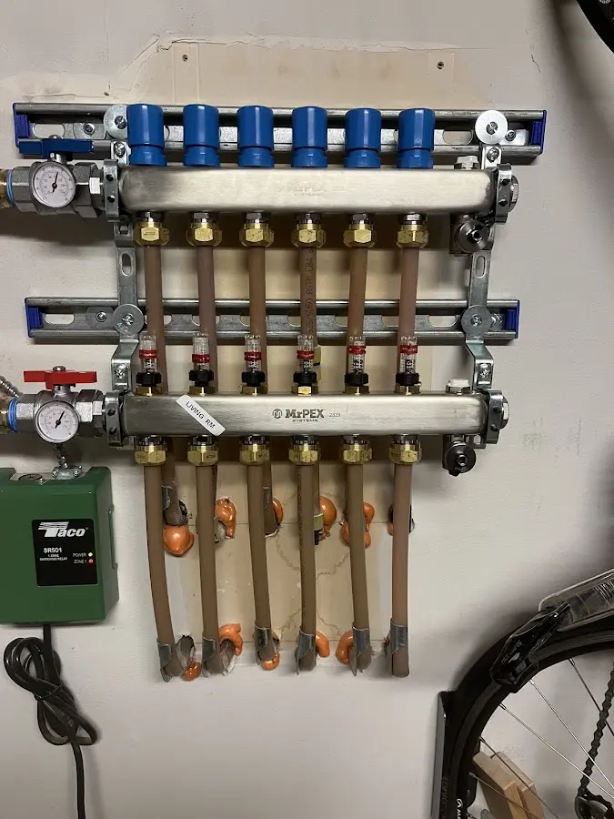 Plumber performing Water Heater Repair at a residential property in Ellisburg